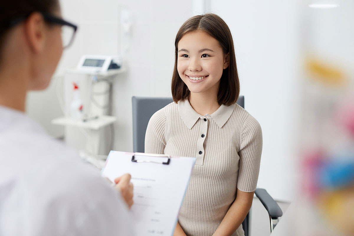 Young Teen Smiling at Medical Staff Member at Gateway ENT St Louis MO